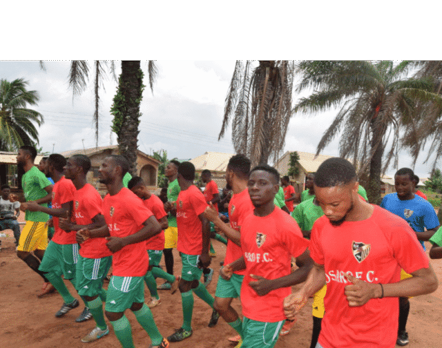 Osaro International Sports Academy youth soccer team practicing outdoors.