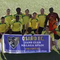 Group of young soccer players and coaches at Osaro Intl Sports Academy, Málaga Spain.