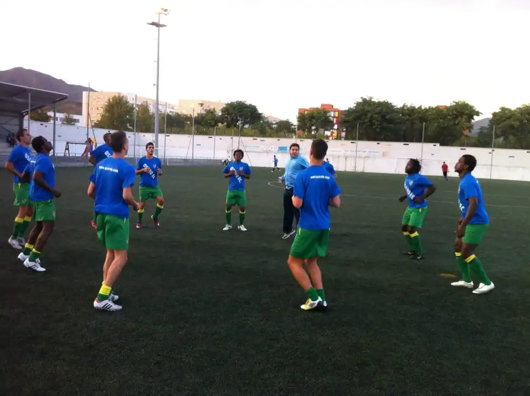 Youth soccer team practicing on an outdoor field at Osaro Intl Sports Academy.