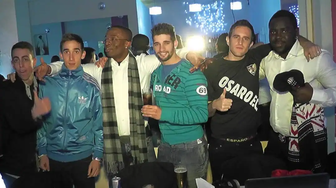 Energetic sports academy members celebrating at Osaro Intl Sports Academy event.